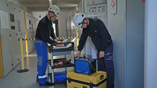 two people in protective gear - Uncredited