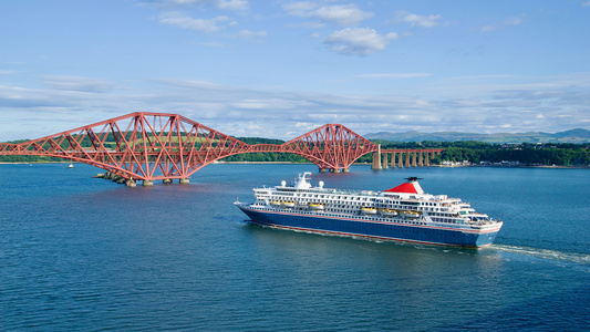 ferry going under forth bridge in scotland - Credit: Shutterstock