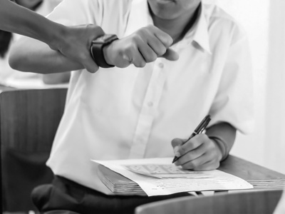 student caught cheating with smartwatch - Credit: Shutterstock