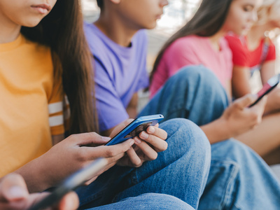 teenagers on phone social media - Credit: Shutterstock
